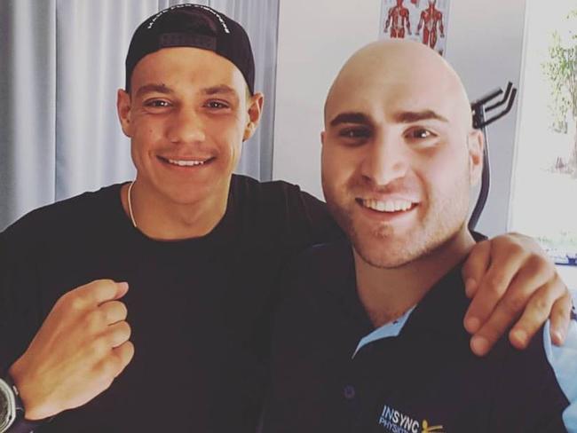 Mr Moubarak, who works as a physiotherapist, is pictured here with boxer Tim Tszyu. Picture: Facebook 