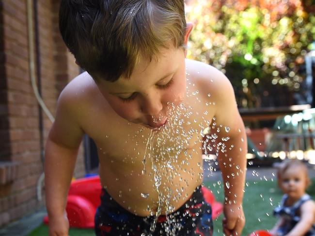 My Day on Instagram. Taking photos of kids is much easier when they are having fun. On a hot day I pulled out the sprinkler. The spray of water with a fast shutter speed freezes every drop. I used a small depth of field so the main subject would stand out while still including the suburban backyard and his brother watching. Picture: Josie Hayden