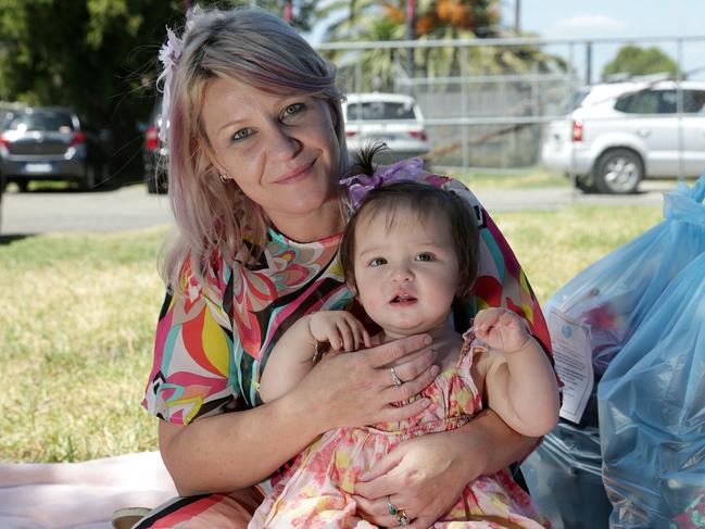 Nicole and baby Harmony are thankful for the food and material aid from Helping Hands Mission. Picture: George Salpigtidis