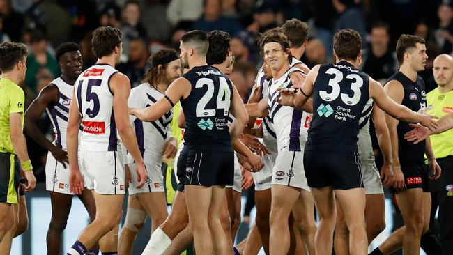 Nat Fyfe and Lewis Young wrestle at the three quarter time at Marvel Stadium. Picture: AFL Photos/Getty Images