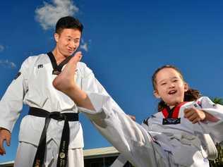 KICKING GOALS: Daniel Choi provides taekwondo classes for children like four-year-old Isla Gardiner. Picture: John McCutcheon