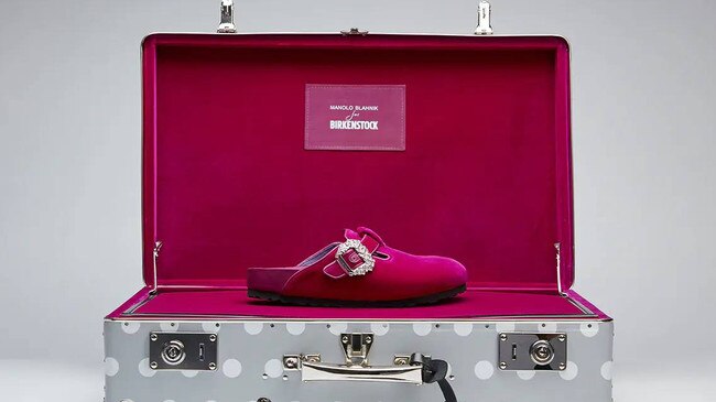 A pair of fuschia mules from the Manolo x Birkenstock collection.