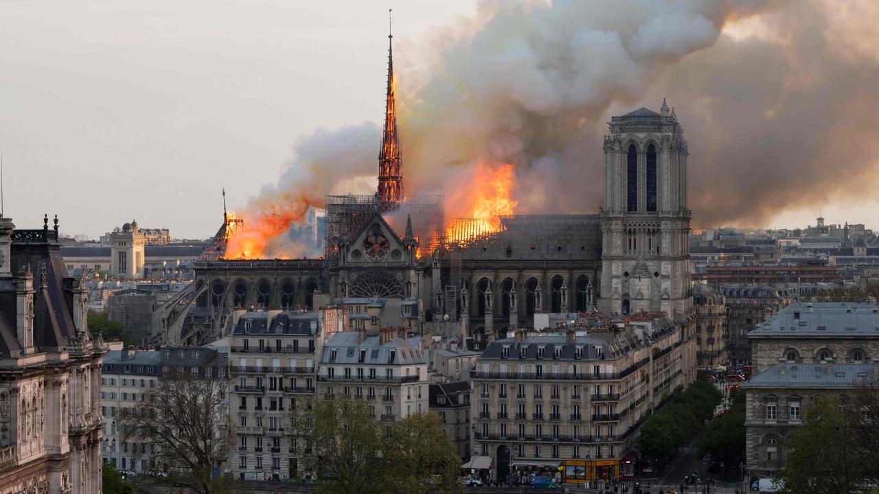 Smoke fills the air as flames burn through the roof of the Notre-Dame de Paris Cathedral on April 15, 2019. Picture: AFP