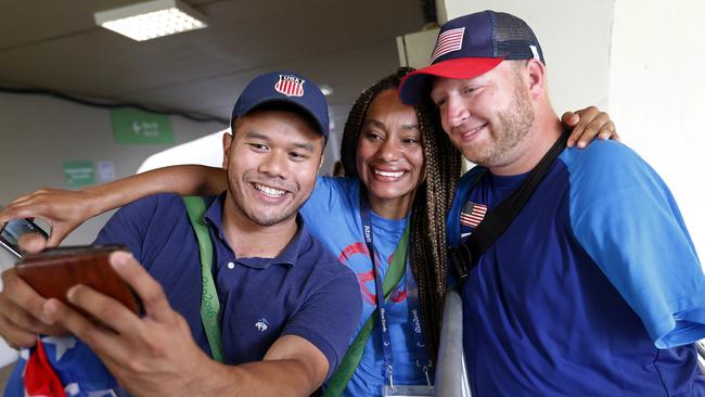 Fans pose for a photo with with Matt Stutzman in Rio. (AP Photo/Silvia Izquierdo)