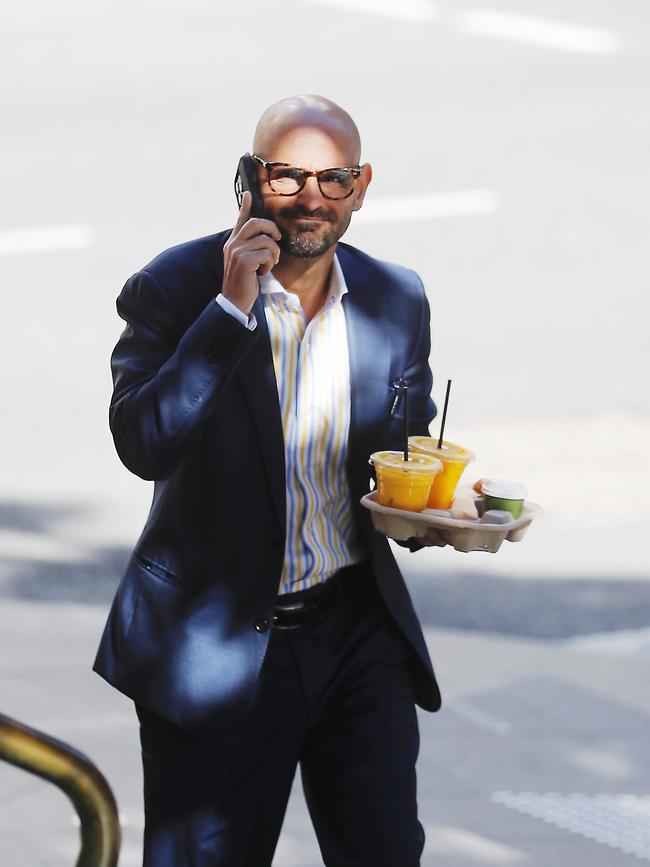 Costellia’s lawyer, Omar Juweinat, arrives at court on Tuesday carrying a tray of OJ. Picture: John Grainger.