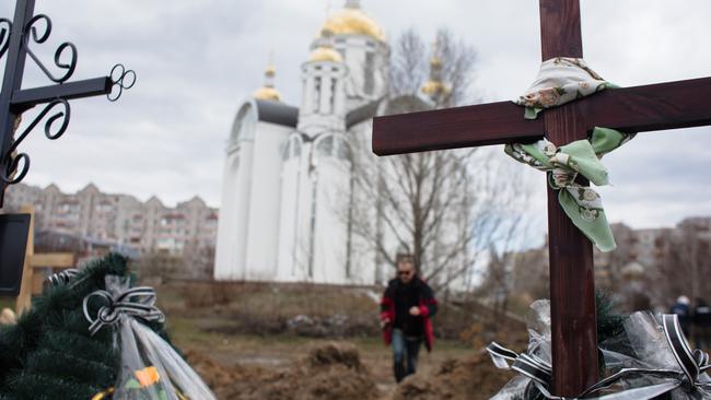 Crosses are seen by a mass grave near a church on April 4 in Bucha.