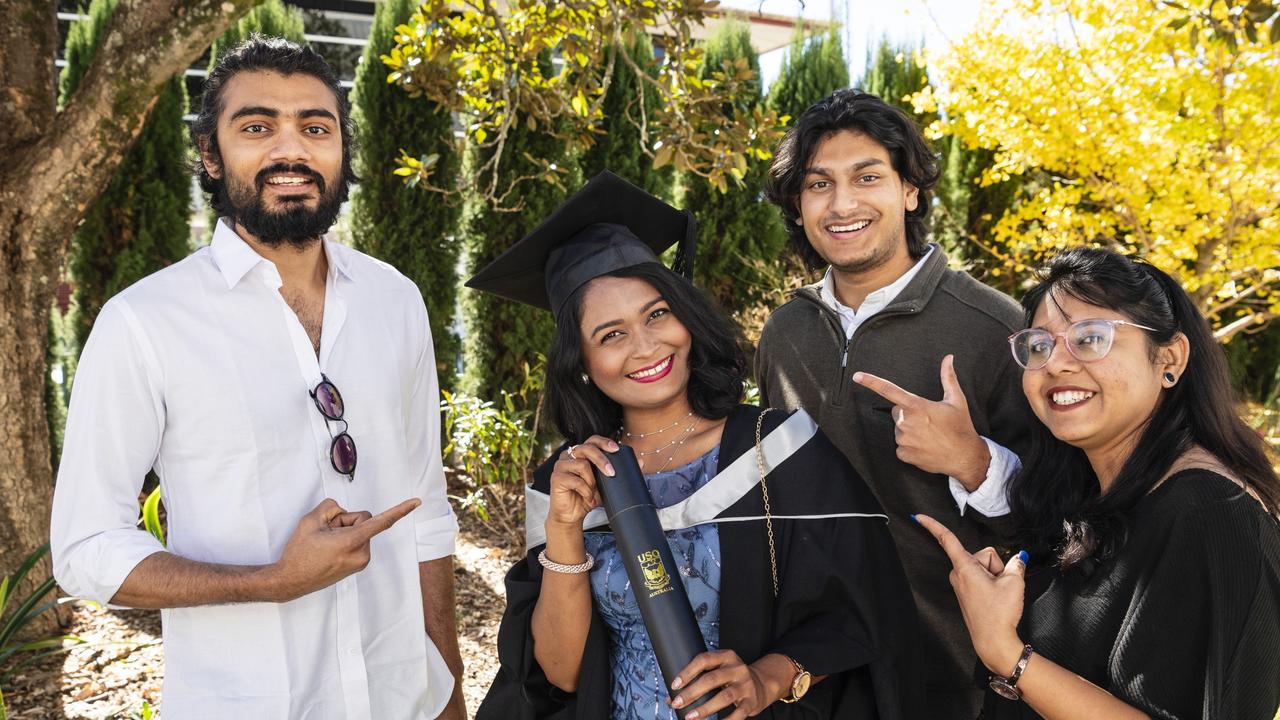 Master of Professional Accounting graduate Moumita Das celebrates her achievement with (from left) Karna Patel, Lahon Hossain and Krishna Ridham at a UniSQ graduation ceremony at Empire Theatres, Tuesday, June 27, 2023. Picture: Kevin Farmer