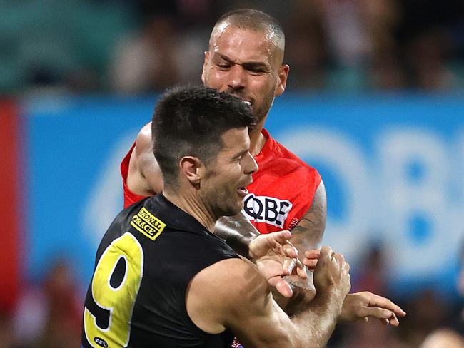 Sydney's Lance Franklin elbows Richmond's Trent Cotchin during the Marn Grook match for Sir Doug Nicholls Round between the Sydney Swans and Richmond Tigers at the SCG. Photo by Phil Hillyard (Image Supplied for Editorial Use only - **NO ON SALES** - Â©Phil Hillyard )