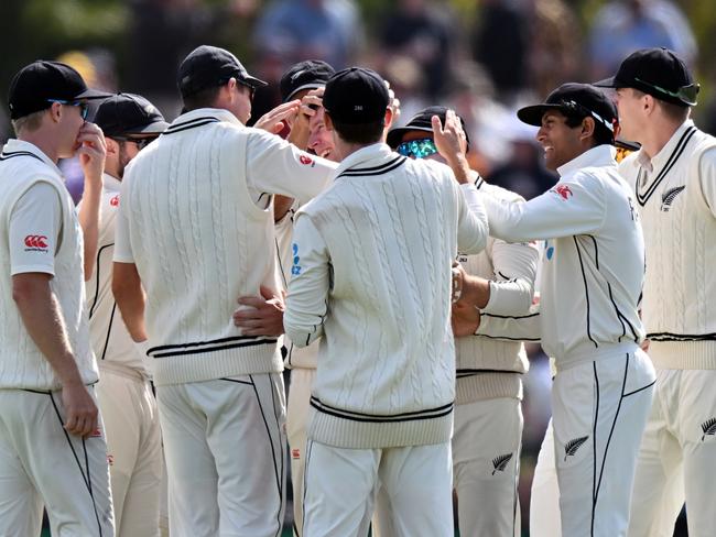 Matt Henry of New Zealand (C) is congratulated by his teammates after dismissing Mitchell Marsh for a duck. Picture: Kai Schwoerer/Getty Images