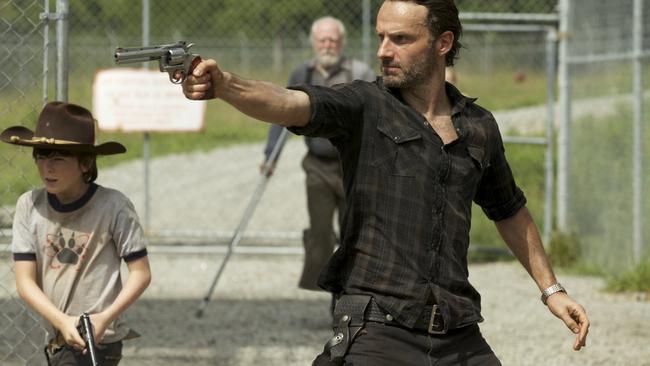Rick and Carl Grimes (Andrew Lincoln and Chandler Riggs) use their guns. Now that’s just a boring way to kill a Walker.
