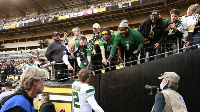 Jets fans celebrate a win with Zach Wilson. Photo by Justin K. Aller/Getty Images