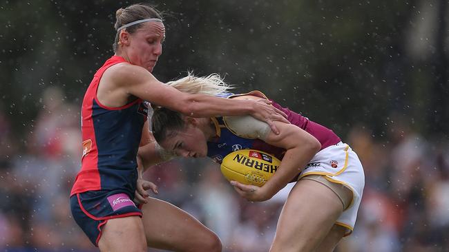 Karen Paxman tackles Brisbane star Tayla Harris in Round 1. Picture: Wayne Ludbey