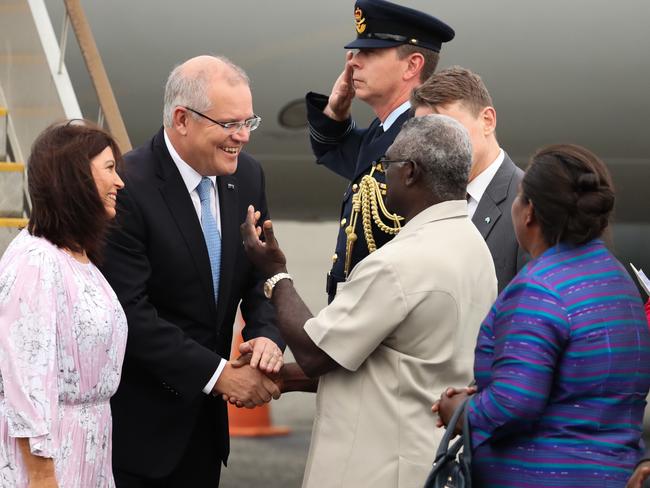 Prime Minister Scott Morrison is greeted by Solomon Islands' Prime Minister Manasseh Sogavare upon his arrival in Honiara. Picture: AAP