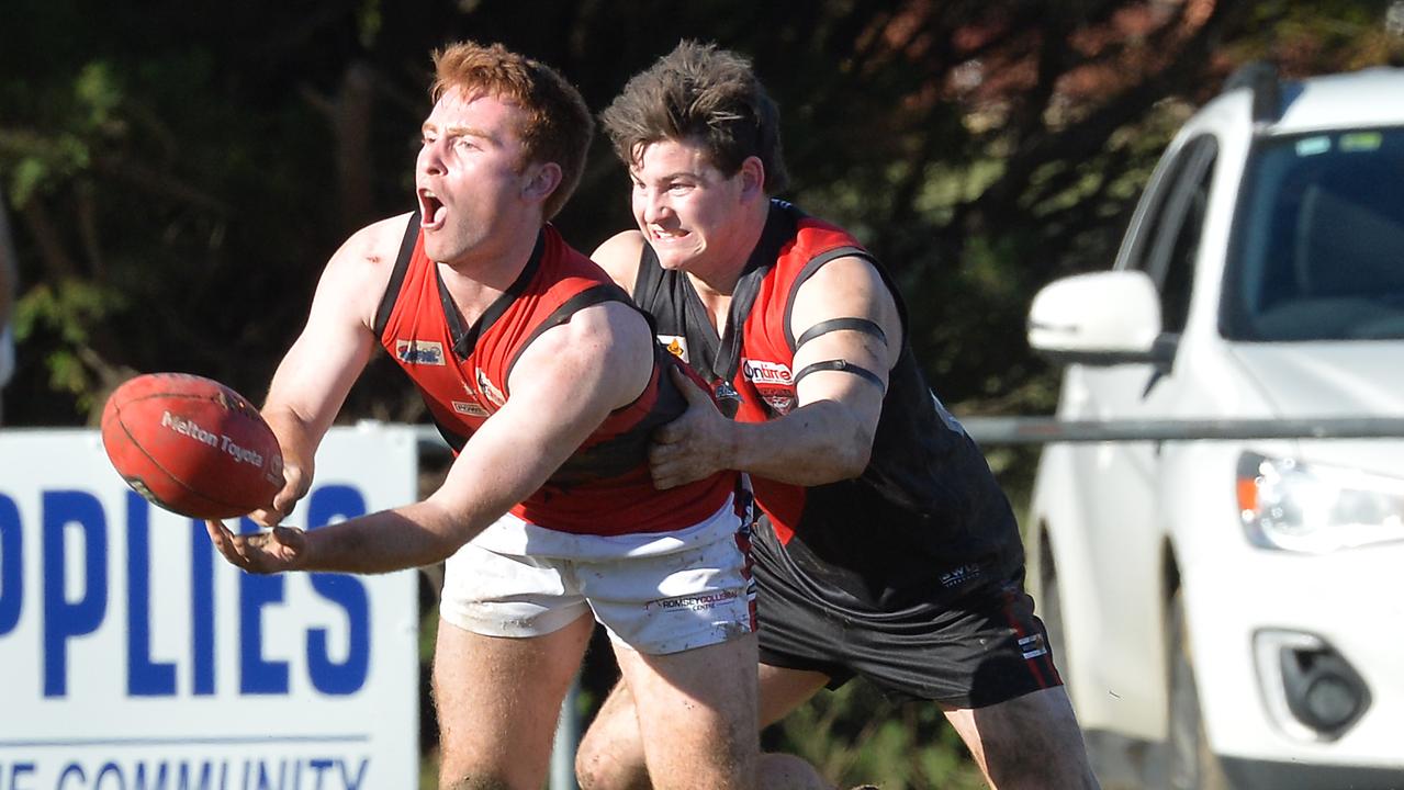 RDFL footy: Riddelll v Romsey. Jack O'Sullivan from Romsey clears the ballP from Nathan Croft.icture:Rob Leeson.