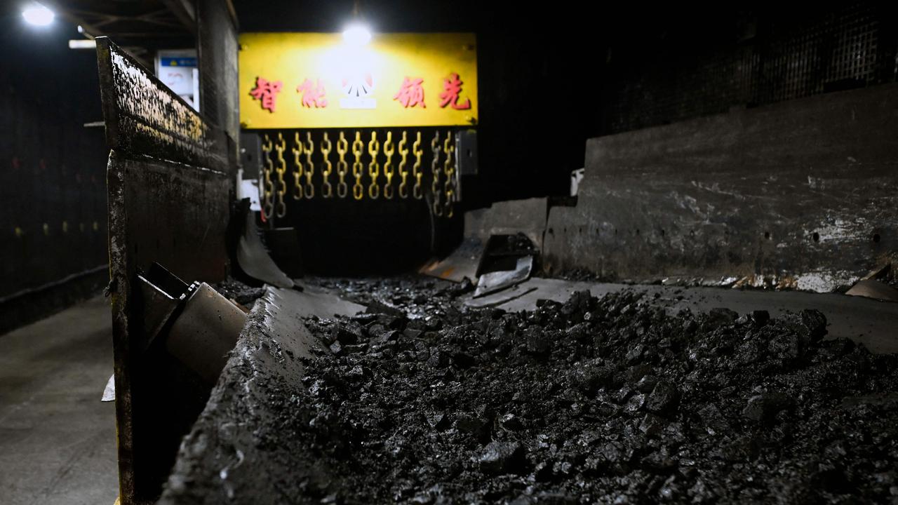 Conservative treasury estimates on iron ore and coal suggest corporate tax take will stay far higher than treasury forecasts. Picture: Wang Zhao/AFP