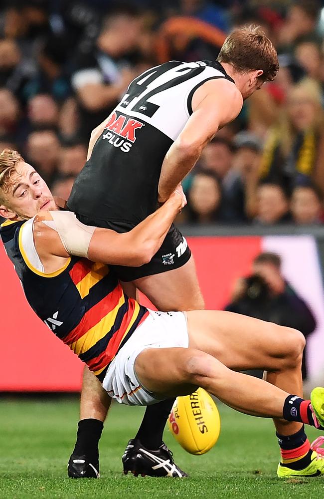 Hugh Greenwood tackles Tom Jonas during a Showdown last year. The two are headlining The Advertiser’s new footy podcast ‘The Lowdown’ in 2019. Picture: Mark Brake (Getty).