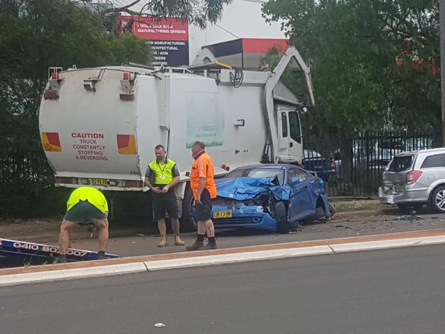 A number of cars were destroyed when a garbage truck left the road in Campbelltown. Picture: Daniel Zautsen