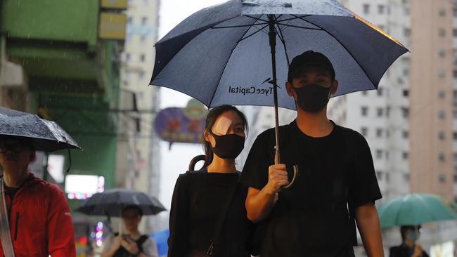 A demonstrator wears an eye patch to show solidarity with a woman injured by a beanbag during a previous protest. Picture: AP