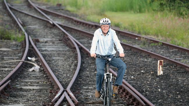 Mayor Barry Longland on a bike on old train tracks. Picture: File