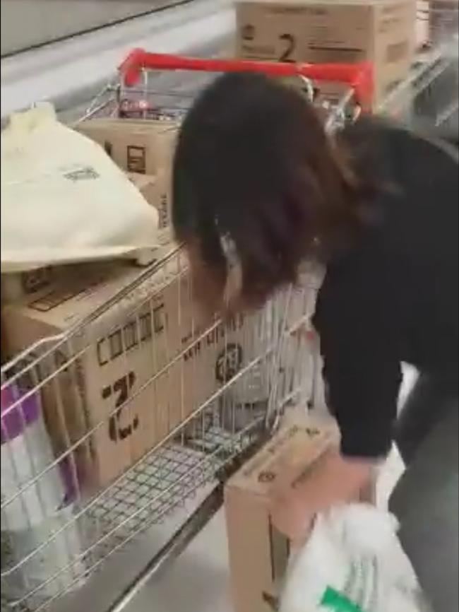 A female shopper seen at Hurstville Coles loading their trolleys with boxes of baby formula.