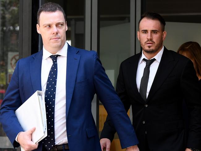 Wests Tigers NRL player Josh Reynolds (right) leaves the Sutherland Local Court in Sydney, Wednesday, December 18, 2019. (AAP Image/Bianca De Marchi) NO ARCHIVING