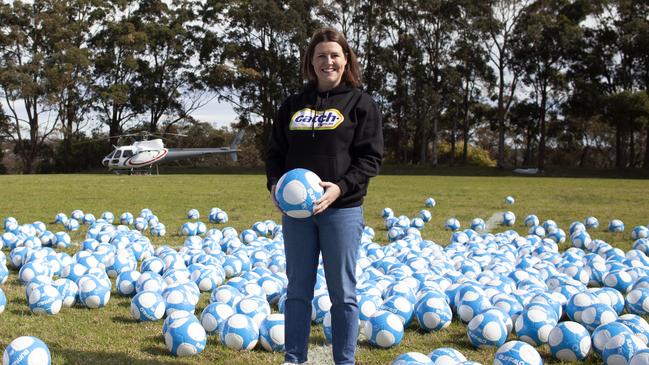 Peita Golden, marketing director at Catch, among 1000 soccer balls on the set for the new Catch.com.au advertising campaign