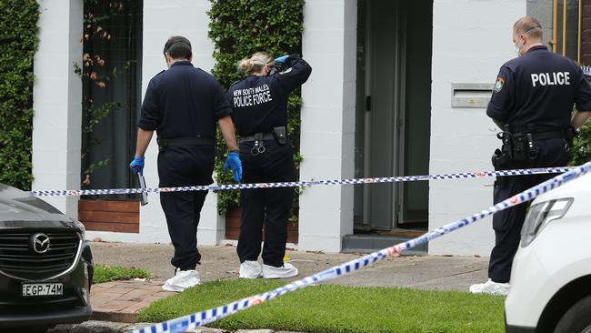 Police outside the Annandale home on Monday. Picture: Richard Dobson