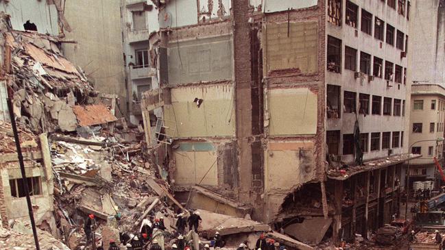 Hezbollah has a long and bloody history of global terror attacks. Here, firefighters and rescue workers search through the rubble of the Jewish Community centre in Buenos Aires, Argentina after a Hezbollah car bomb rocked the building on the 18 Jul 1994. (AP Photo/Alejandro Pagni)