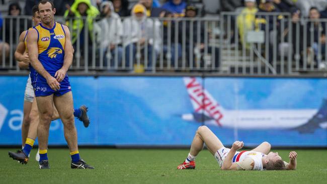 Shannon Hurn and Mitch Honeychurch in the aftermath of their collision. Picture: AAP