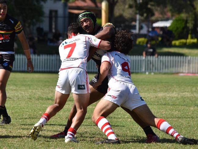 Heinz Lemoto is tackled by Harley Yates (left) and Omar Dennaoui in the Harold Matthews Cup. Picture: Sean Teuma/NewsLocal