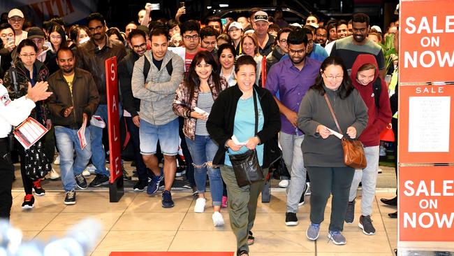 Bargain hunters rush in as the doors open at 5am at the Myer Boxing Day sale. Picture: Nicole Garmston