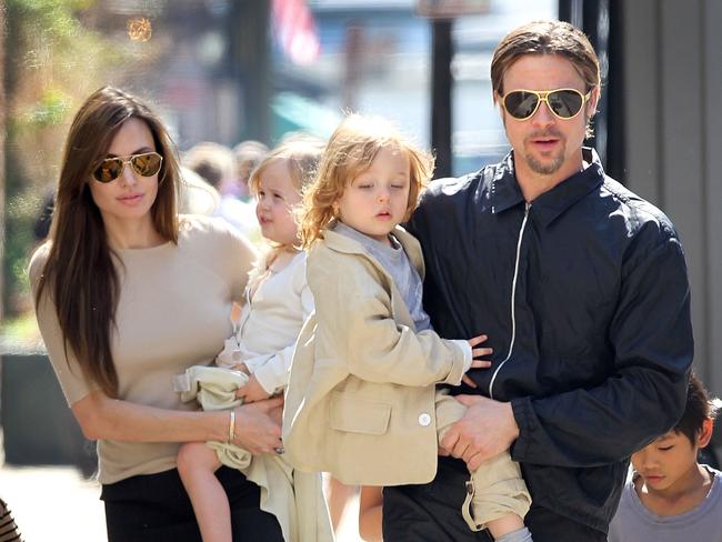 Jolie, holding Vivienne and Pitt, holding Knox back in 2011. Picture: Splash News Australia