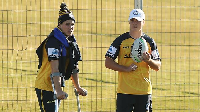 Injured Mitchell Moses with Jai Field during Eels training on Tuesday. Picture: Brett Costello