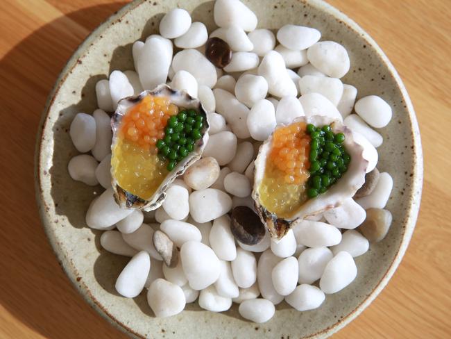 Oysters with honey dew rock melon and dill pearls.