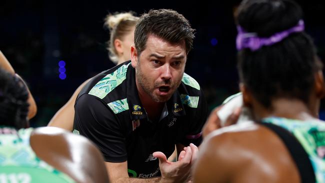 PERTH, AUSTRALIA - JULY 21: Dan Ryan, Coach of the Fever talks to the players at the 3rd quarter time break during the Super Netball Minor Semi Final match between West Coast Fever and Sunshine Coast Lightning at RAC Arena, on July 21, 2024, in Perth, Australia. (Photo by James Worsfold/Getty Images)