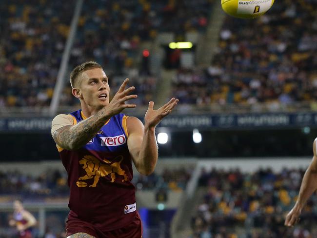 Dayne Beams watched on from the bench in the last quarter as the Lions were thrashed by Collingwood. Picture: Peter Wallis