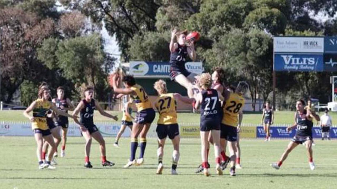 Redleg Ned Bowman juggles the mark as he prepares for a crash landing. Picture: Supplied.