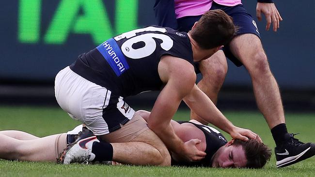 Jed Lamb lies unconscious after an off the ball incident with Bachar Houli. Picture: Michael Klein