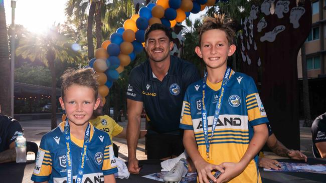 Eels’ player Dylan Brown with Ryan and Nate Burke at a signing session in Darwin. Picture: Pema Tamang Pakhrin