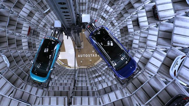 Volkswagen ID.4, right, and ID.3, left, electric cars at the company’s storage facility auto tower in Wolfsburg, northern Germany. Picture: AFP