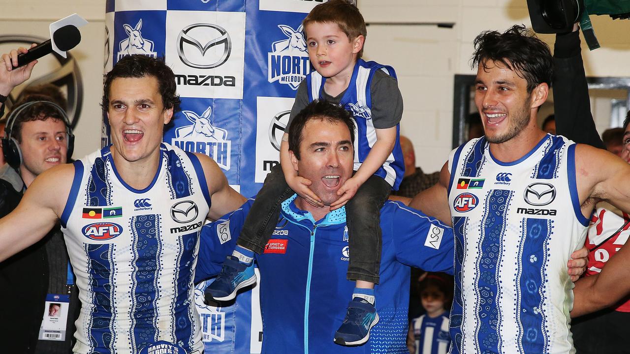 Brad Scott sings the Kangaroos song after the game. (Photo by Michael Dodge/Getty Images)