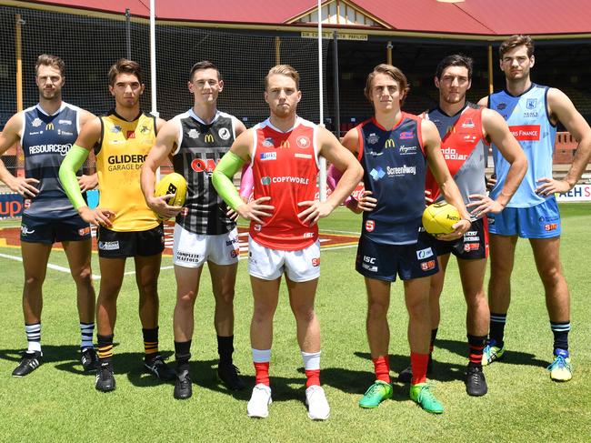 Keegan Brooksby (South Adelaide), Cameron Buchanan (Glenelg), Sam Davison (Port Adelaide), Michael Virgin (North Adelaide), Chris Olsson (Norwood), Lochie Peter (West Adelaide) and Tom Read (Sturt) pose for a photograph at the Norwood Oval, Norwood, Adelaide on Friday the 2nd of February 2018. The SANFL Fast Footy pre-season competition is Friday the 9th and Saturday the 10th of February at Norwood Oval. (AAP/ Keryn Stevens)