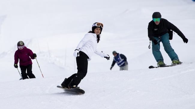 Tulsi Gabbard snowboards with supporters in North Conway, New Hampshire. Picture: AP