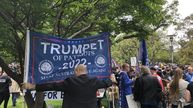 A man holds a flag in the style of a Trump/ Make America Great again flag. Picture Keryn Stevens