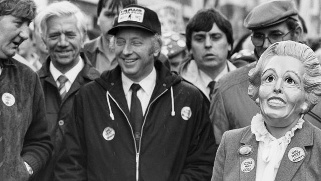 National Union of Mineworkers' (NUM) General Secretary Arthur Scargill during a demonstration against pit closures in Stoke, Staffordshire, March 1984. A supporter can be seen wearing a Margaret Thatcher mask. Picture: SSPL/Getty Images