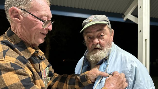 Alan Jonston pins Ron Rye's medals before the start of the Anzac Day Dawn Service at Mudjimba’s Power Memorial Park. The pair served in South Vietnam, Ron from 1966 to the beginning of 1968 and Alan in 1971 and 1972.