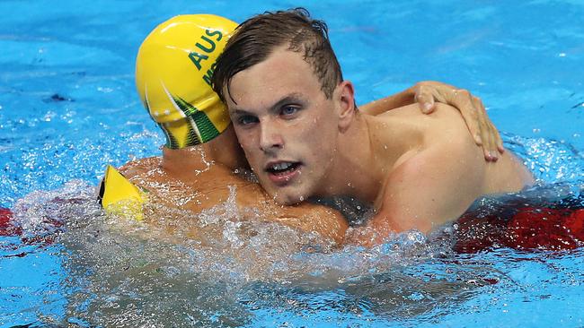 Kyle Chalmers celebrates winning the 100m freestyle final with Cameron McEvoy. Picture: Brett Costello