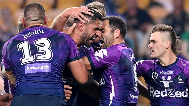 BRISBANE, AUSTRALIA - OCTOBER 16: Jesse Bromwich of the Storm celebrates with team mate Cameron Smith during the NRL Preliminary Final match between the Melbourne Storm and the Canberra Raiders at Suncorp Stadium on October 16, 2020 in Brisbane, Australia. (Photo by Bradley Kanaris/Getty Images)