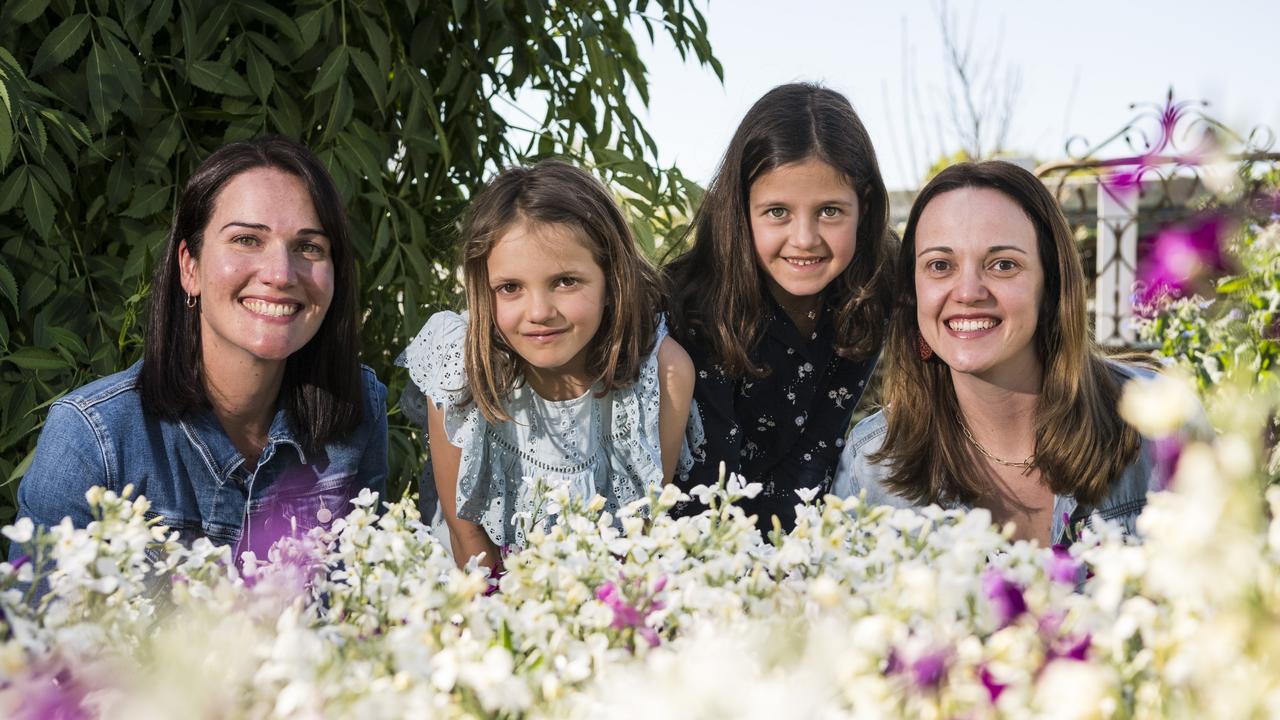 Checking out the flowers are (from left) Emily Vogler, twins Clara and Chloe Betros and Taisa Morassi in Leisa and Serge Rossignol's Grand Champion garden of The Chronicle Garden Competition of the Carnival of Flowers. Picture: Kevin Farmer