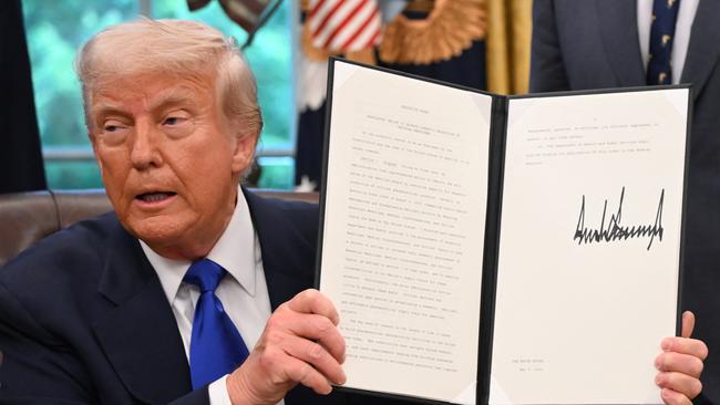 US President Donald Trump speaks to the media while signing executive orders in the Oval Office of the White House, in Washington, DC, on May 5, 2025. Trump signed several health care-related executive orders, according to a White House statement. (Photo by Alex Wroblewski / AFP)